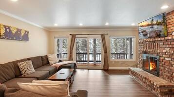 House, Multiple Beds, Balcony | Living area | 42-inch TV with digital channels, fireplace