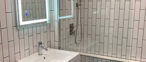Shower, hair dryer, towels, soap