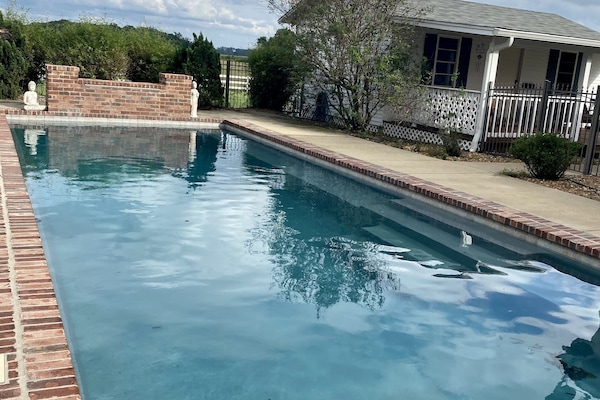 16' x 40' pool, ranges from 3.5' to 5'10" deep with sitting shelf along one side