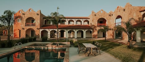 Outdoor pool, open 9:00 AM to 11:30 PM, pool umbrellas