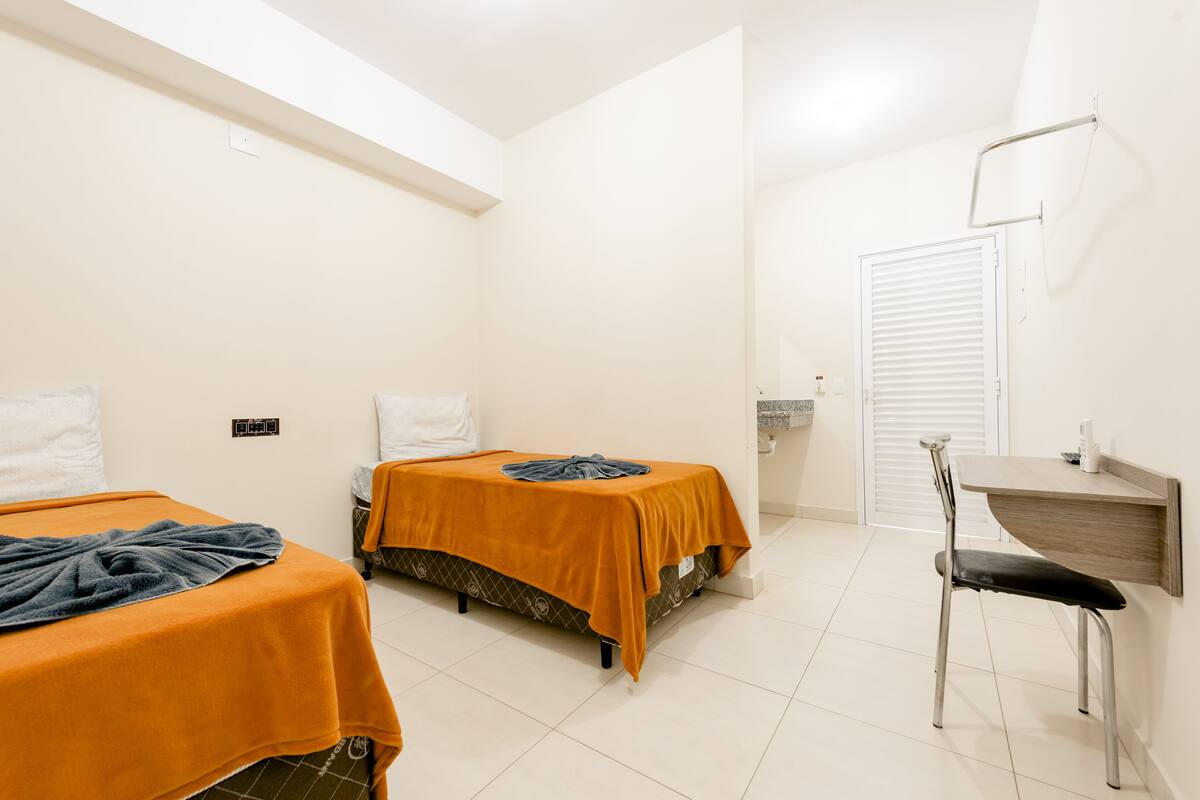 Desk, laptop workspace, free WiFi, bed sheets