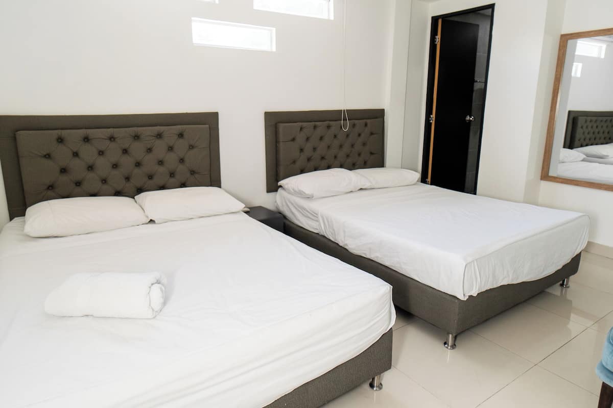 Quadruple Room | Hypo-allergenic bedding, iron/ironing board, free WiFi, bed sheets