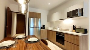 Coffee/tea maker, fridge, microwave, oven