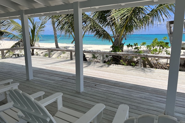 Sea Biscuit's porch and deck overlooks the turquoise sea.