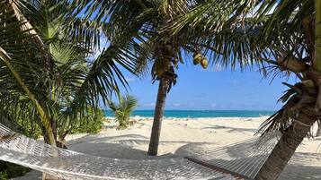 On the beach, sun-loungers, beach towels