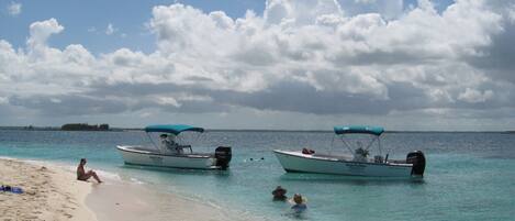 On the beach, sun-loungers, beach towels