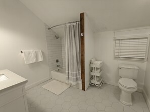 Combined shower/tub, hair dryer, towels, soap
