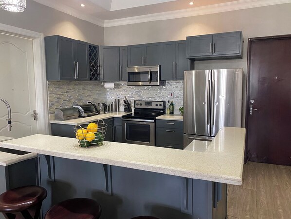Fridge, microwave, oven, stovetop - The Sky Lounge - 2BD APT w/Amazing Roof Deck Views (Kingston)