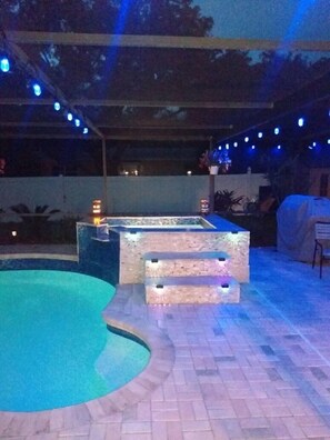 A swimming pool with a stone deck and a small hot tub area. - Amazing Pool HOME , FREE HEATED Spa only 2 Miles to Beach!Sleeps 10 !!  (Largo)