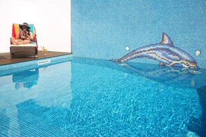 A swimming pool with a mosaic tile wall and a dolphin mural. - 2Stay - A1 Local Accommodation with swimming pool (Ponta Delgada)