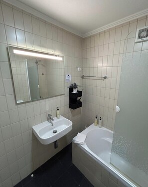 Combined shower/tub, hair dryer, towels, soap