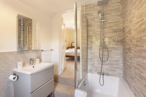 Bathtub, hair dryer, towels, soap