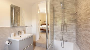 Bathtub, hair dryer, towels, soap