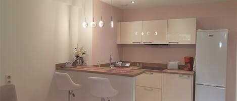 Fridge, microwave, stovetop, coffee/tea maker