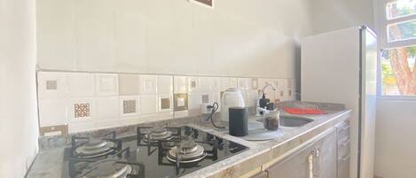 Fridge, stovetop, electric kettle, toaster