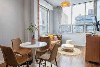 Penthouse Suite | Living room | 42-inch Smart TV with cable channels, TV, printers at The Modernist Hotel