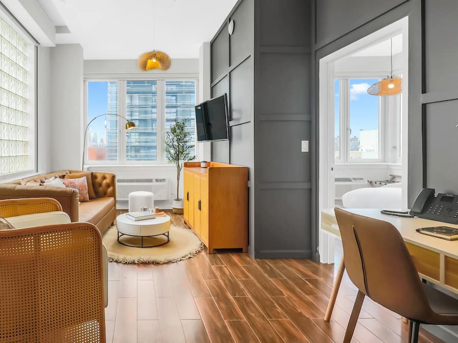 1 BR Manhattan View Suite - King Bed | Living area | 42-inch Smart TV with cable channels, TV, printers