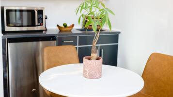 Mini-fridge, microwave, coffee/tea maker, cookware/dishes/utensils