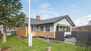 A two-story house with a brick exterior and a grey roof. - Gorgeous home in Nexø with WiFi (Nexø)