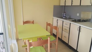 Fridge, coffee/tea maker, electric kettle, cookware/dishes/utensils