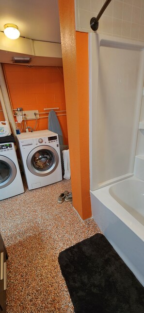 Combined shower/bathtub, hair dryer, towels, soap