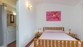 Family Apartment, 2 Bedrooms, 2 Bathrooms (Erica Primo Piano 150m From the Beach) | 2 bedrooms, iron/ironing board, bed sheets