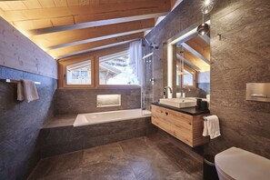 Bathtub, hair dryer, towels