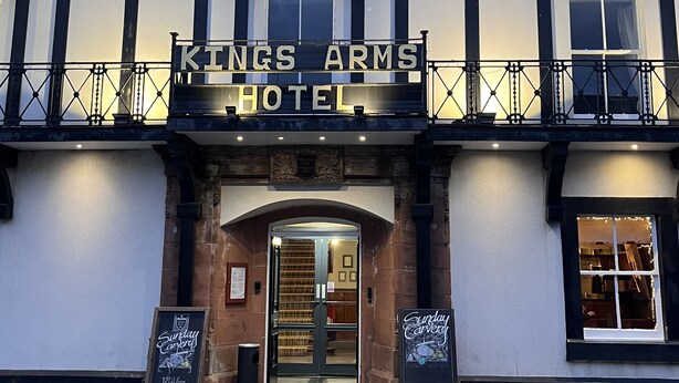 The exterior of Kings Arms Hotel with a traditional facade, a prominent sign, and a small signboard advertising Sunday Carvery. - The Kings Arms Hotel (Lockerbie)