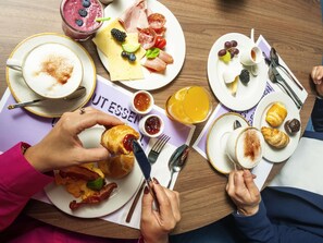 A breakfast setting with various food items and utensils on a table. - Ibis Styles St Margrethen Bodensee (Sankt Margrethen)