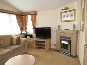 House | Living area | 30-inch TV with cable channels, fireplace - Caravan -chapel, Skegness With Decking From March (Skegness)
