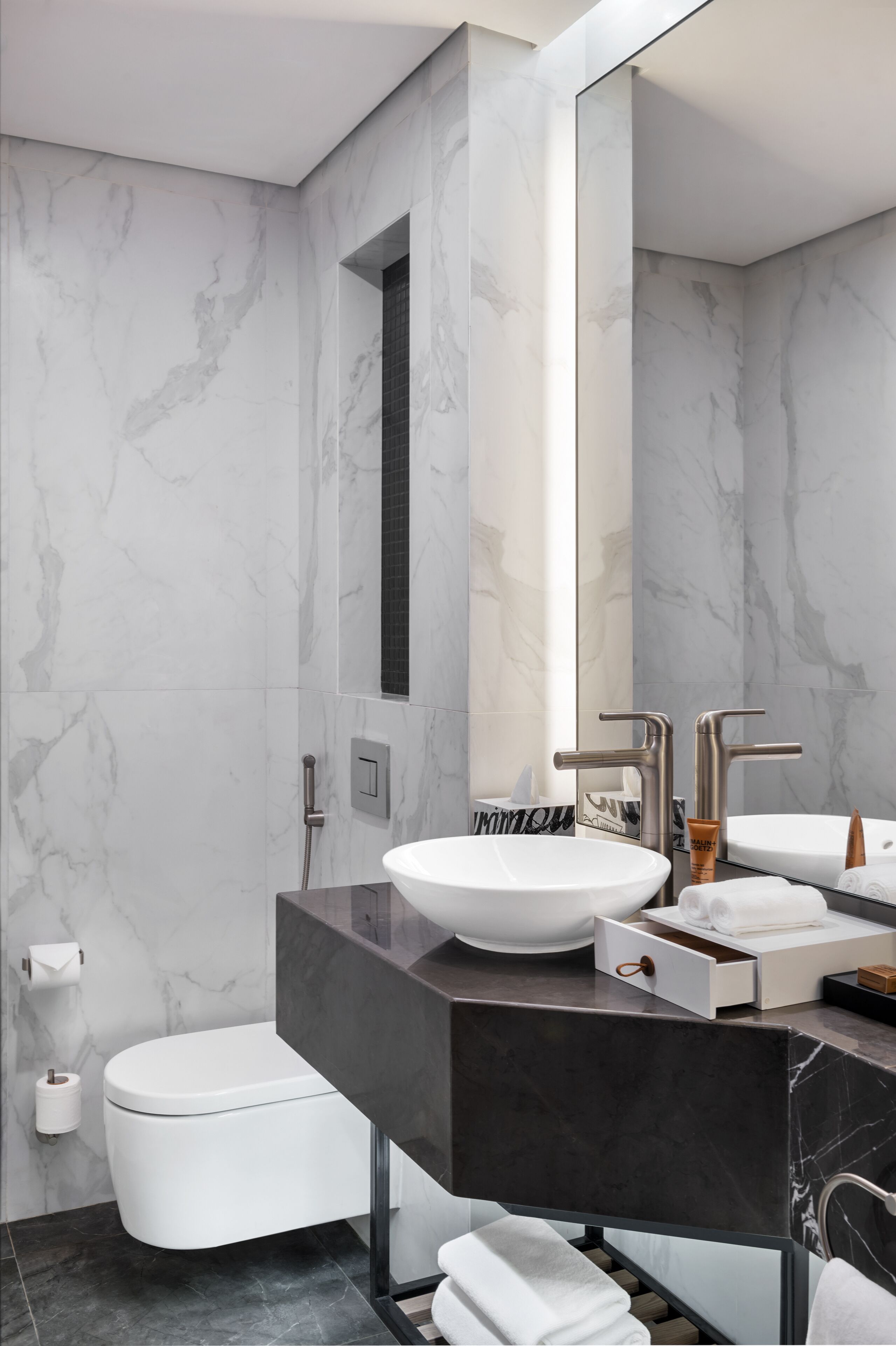 deep-soaking bathtub, designer toiletries, hair dryer, bathrobes