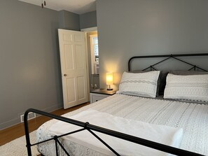 1 bedroom, desk, iron/ironing board, travel crib