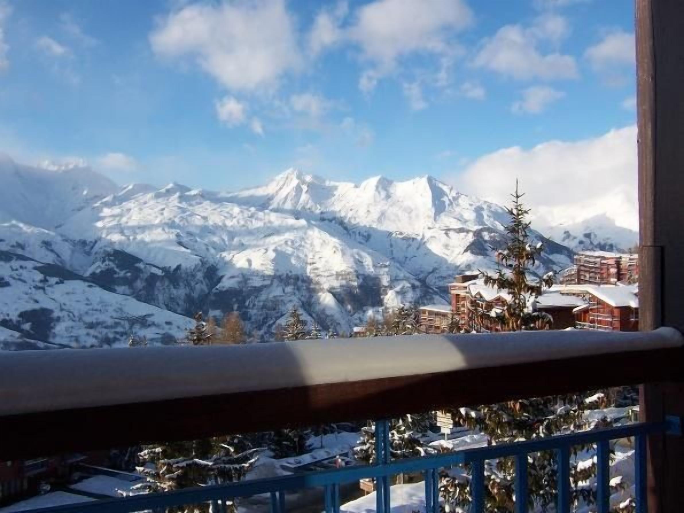 A snow-covered mountain range with a clear sky.