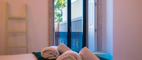 1 bedroom, desk, iron/ironing board, travel crib