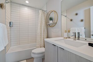 Combined shower/tub, hair dryer, towels, soap