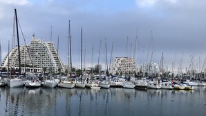 A marina with multiple boats docked, surrounded by modern buildings with balconies. - T.2 SUPERB SEA VIEW "COCOONING FAVORITE" CLASS 2 STARS!!!! (La Grande-Motte)