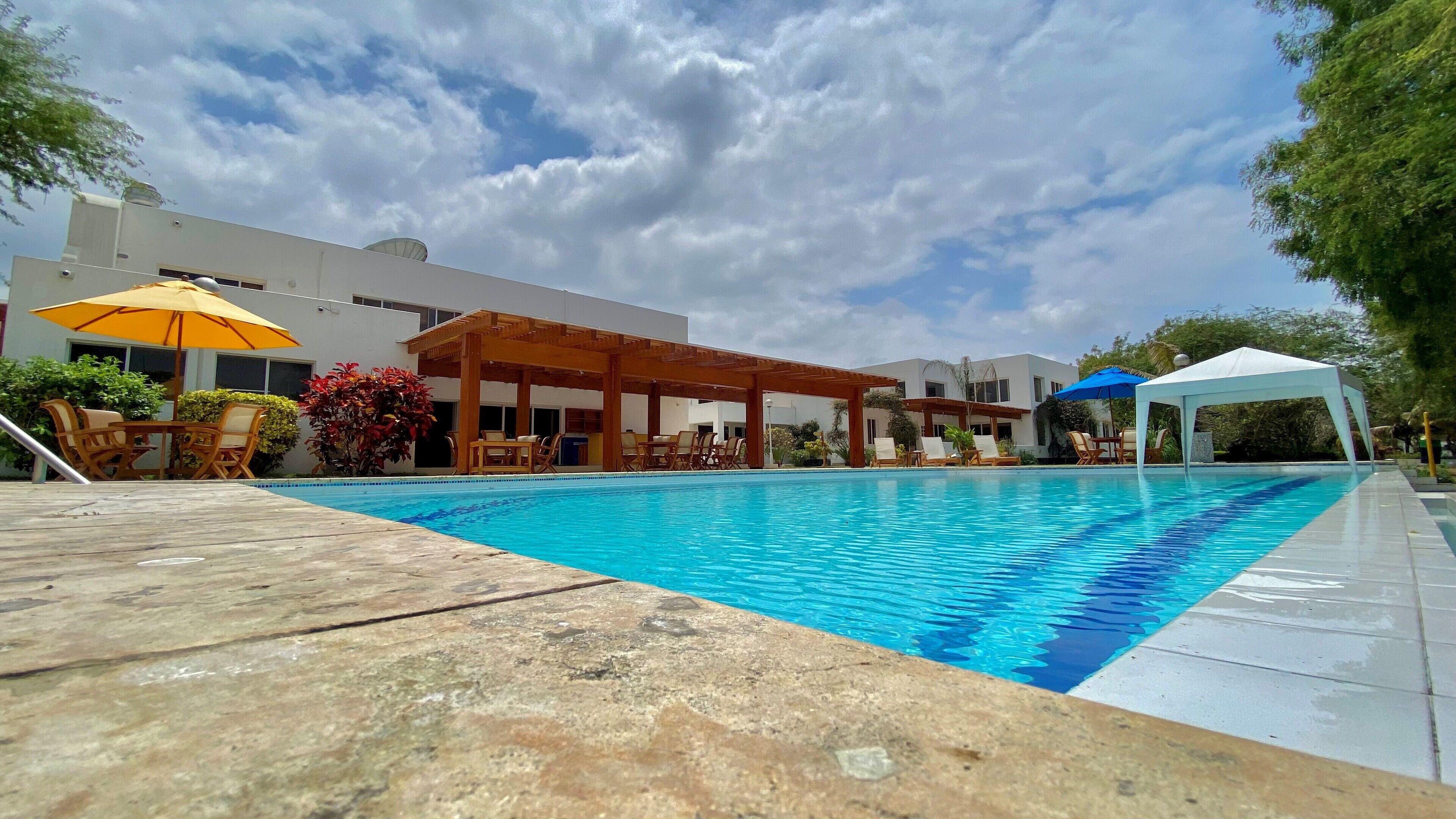 Outdoor pool, open 10:00 AM to 10:00 PM, pool umbrellas, sun loungers