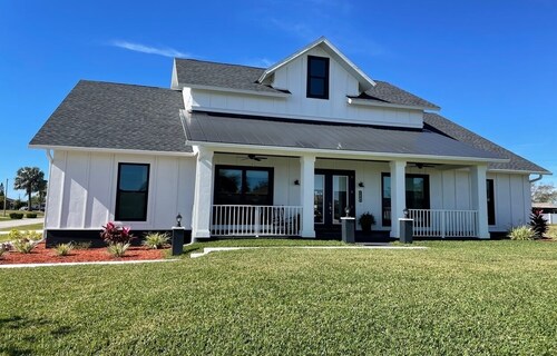 Newly built Farmhouse style home located in Cape Coral. Close to Beaches.