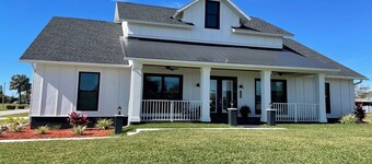 Newly built Farmhouse style home located in Cape Coral. Close to Beaches.