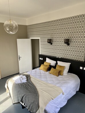 Premium bedding, pillow-top beds, free minibar, laptop workspace