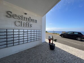 Welcome to Sesimbra Cliffs, where the hotel's name greets you above a charming entrance.