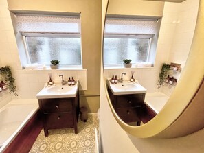 Combined shower/tub, hair dryer, towels, toilet paper
