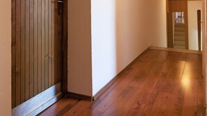 A hallway with wooden flooring and a wooden door with a frosted glass window. - Guesthouse Žafran- Double Room With Terrace (Plitvicka Jezera)
