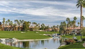 Enjoy a round of golf surrounded by lush greenery and serene water features.