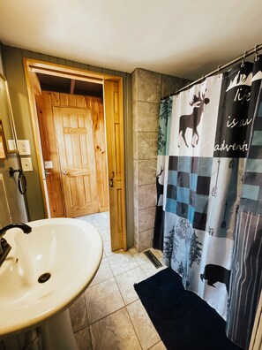 Shower, hair dryer, towels, toilet paper