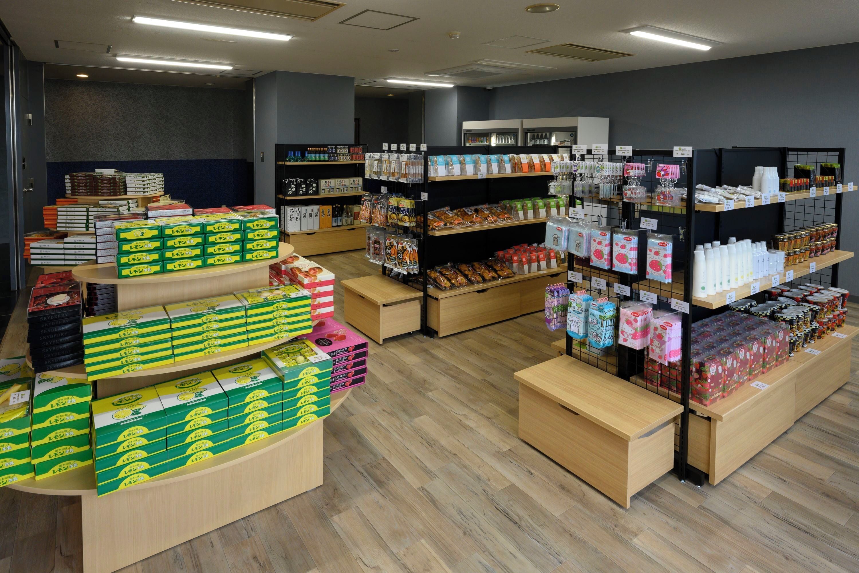 A store with shelves stocked with various products, including boxes and bottles.