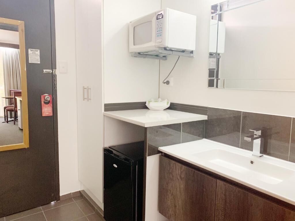 Shower, rainfall showerhead, hair dryer, towels