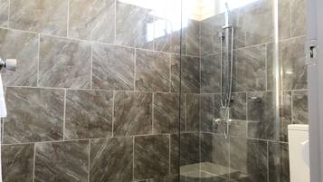 Shower, rainfall showerhead, hair dryer, towels