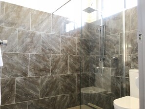 Shower, rainfall showerhead, hair dryer, towels