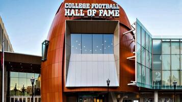 A building with a large sign reading "College Football Hall of Fame".